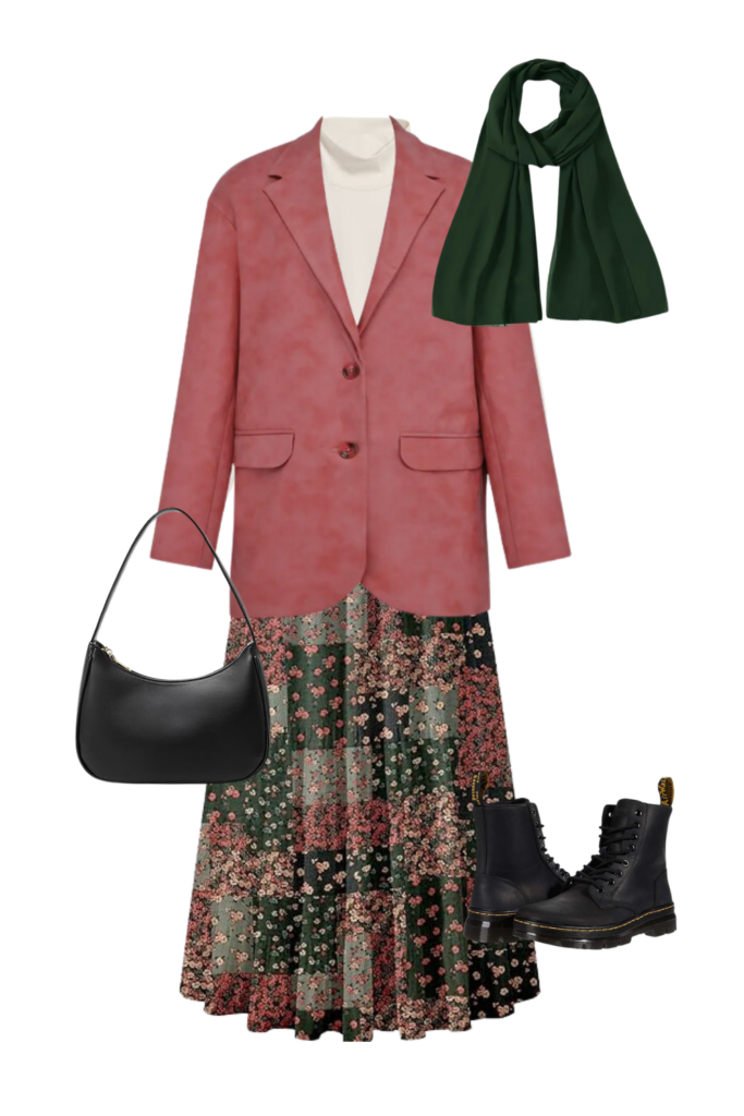 Modest fall outfit with a white turtleneck, floral maxi skirt, pink blazer, dark green scarf, black leather shoulder bag, and black lace-up boots. Perfect for cozy, layered style with a touch of elegance and functionality.