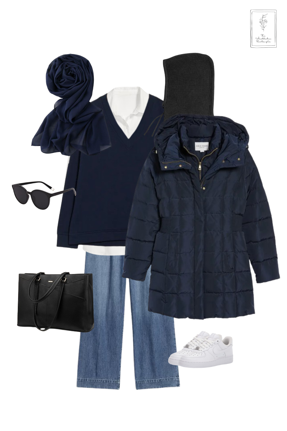 A casual winter outfit featuring a navy blue puffer coat layered over a white button-down shirt and a navy V-neck sweater. The look includes wide-leg blue jeans, white sneakers, and a navy chiffon hijab. Accessories include a black beanie, black sunglasses, and a sleek black tote bag for a modern and functional style.