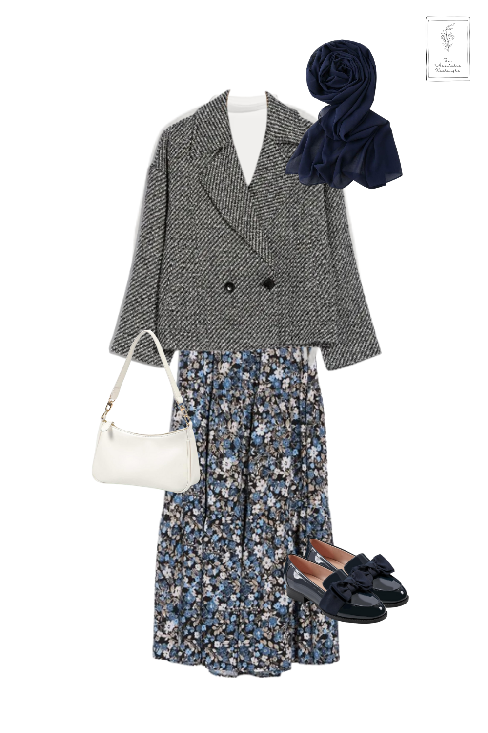 A timeless blend of elegance and coziness, this outfit layers textures and patterns for a polished yet effortless look. A soft gray wrap sweater over a white top pairs beautifully with a flowy floral midi skirt, bringing a touch of femininity. The structured herringbone blazer adds a refined contrast, while the navy chiffon scarf and patent loafers with bow details elevate the ensemble with a sophisticated charm. A crisp white shoulder bag ties everything together, making this the perfect outfit for a chic autumn day out.
