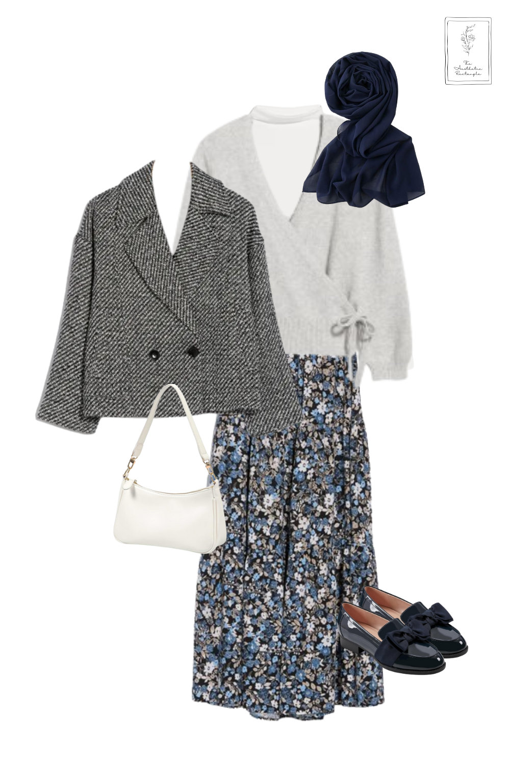 A timeless blend of elegance and coziness, this outfit layers textures and patterns for a polished yet effortless look. A soft gray wrap sweater over a white top pairs beautifully with a flowy floral midi skirt, bringing a touch of femininity. The structured herringbone blazer adds a refined contrast, while the navy chiffon scarf and patent loafers with bow details elevate the ensemble with a sophisticated charm. A crisp white shoulder bag ties everything together, making this the perfect outfit for a chic autumn day out.
